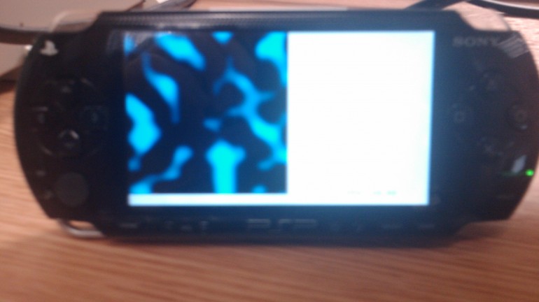 Another picture of a simplex noise procedurally generated texture being rendered on the screen of a PlayStation Portable Developer Kit. 