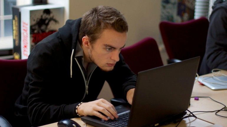 A picture of me (Luc Shelton) staring intently at the laptop computer screen during the final hours of the 48 hour game jam.