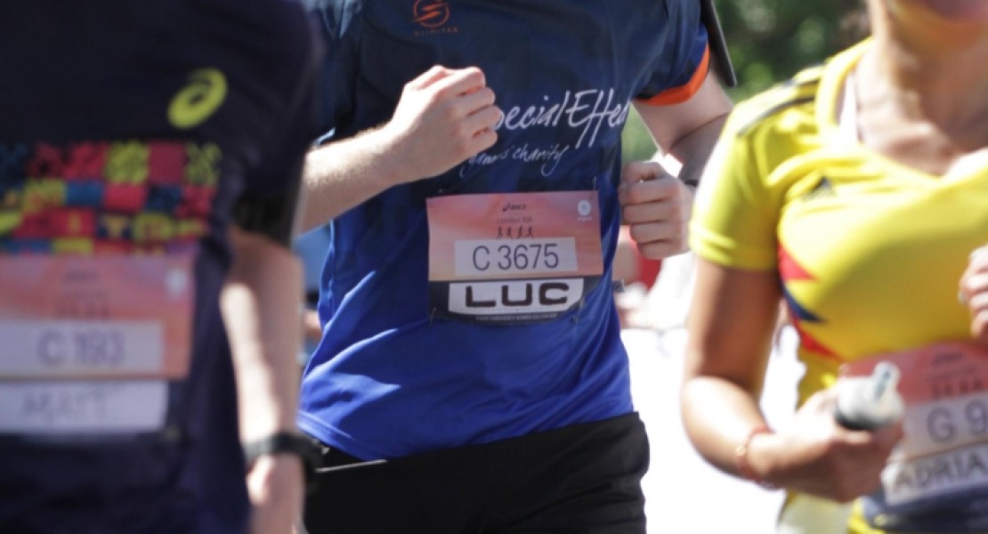 A picture of myself (Luc Shelton) running between two other participants towards the finish line at the ASICS London 10K.