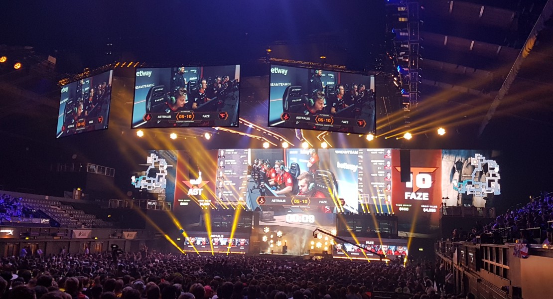 Mid-game picture of Astralis versus FaZe, taken from the far back right hand corner of the stadium.